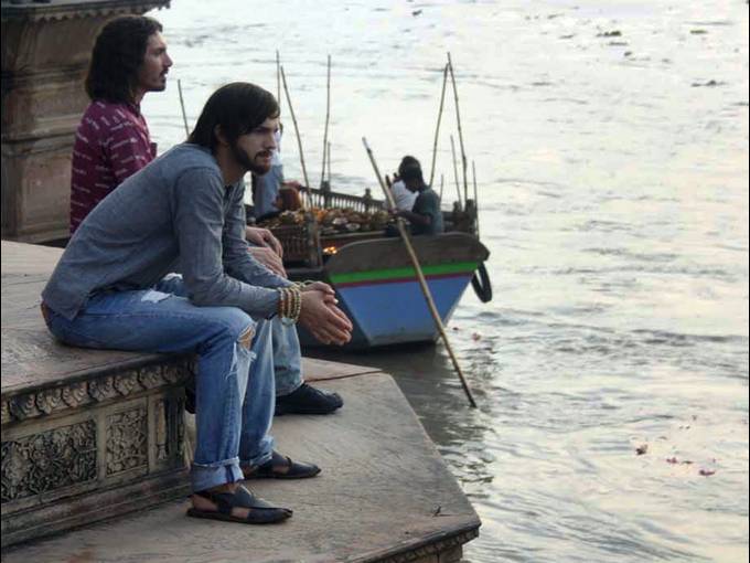 people sitting by river