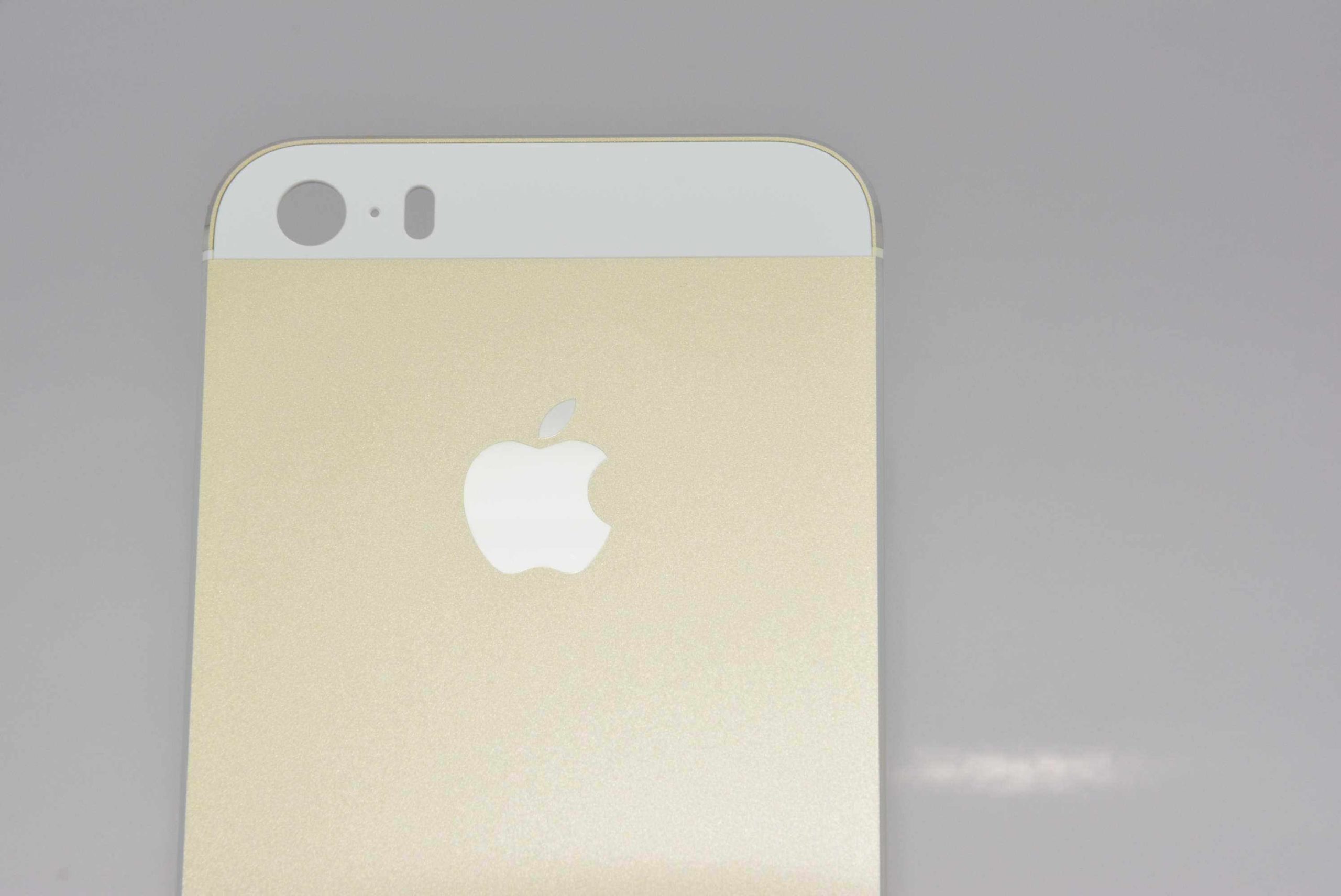 gold smartphone top closeup