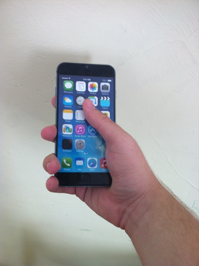 iPhone 6 in hand iPhone 6 in hand