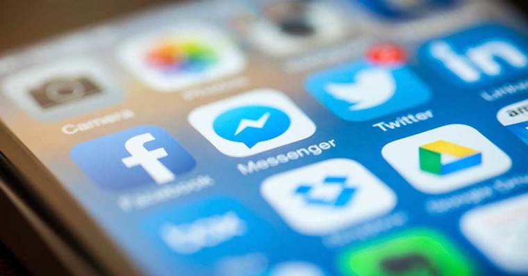 Facebook on an iPhone home screen drawing focus to the Facebook app and the accompanying Messenger app. March 23, 2014 Facebook on an iPhone home screen drawing focus to the Facebook app and the accompanying Messenger app