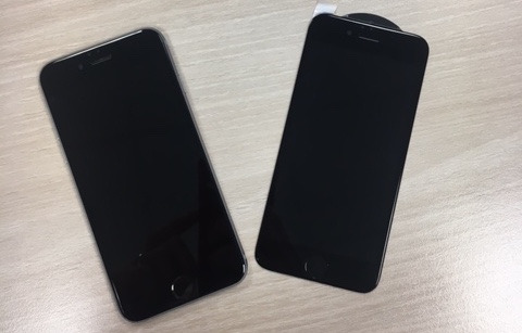 two iphones on desk