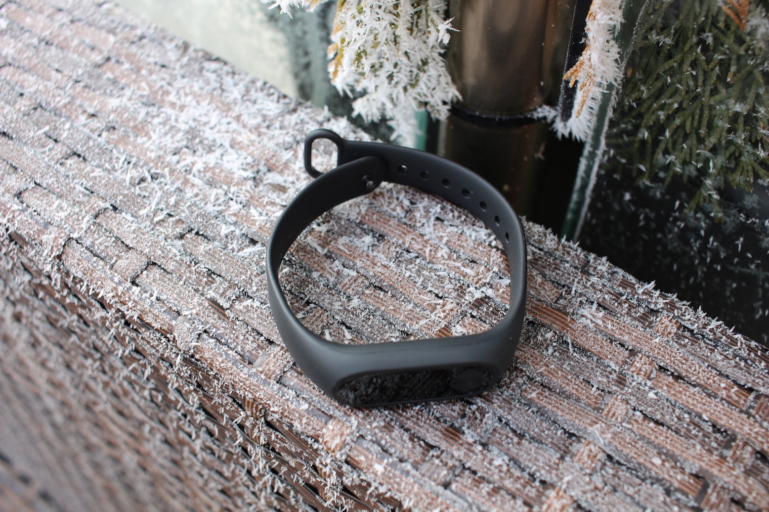 black smartwatch on frosty surface