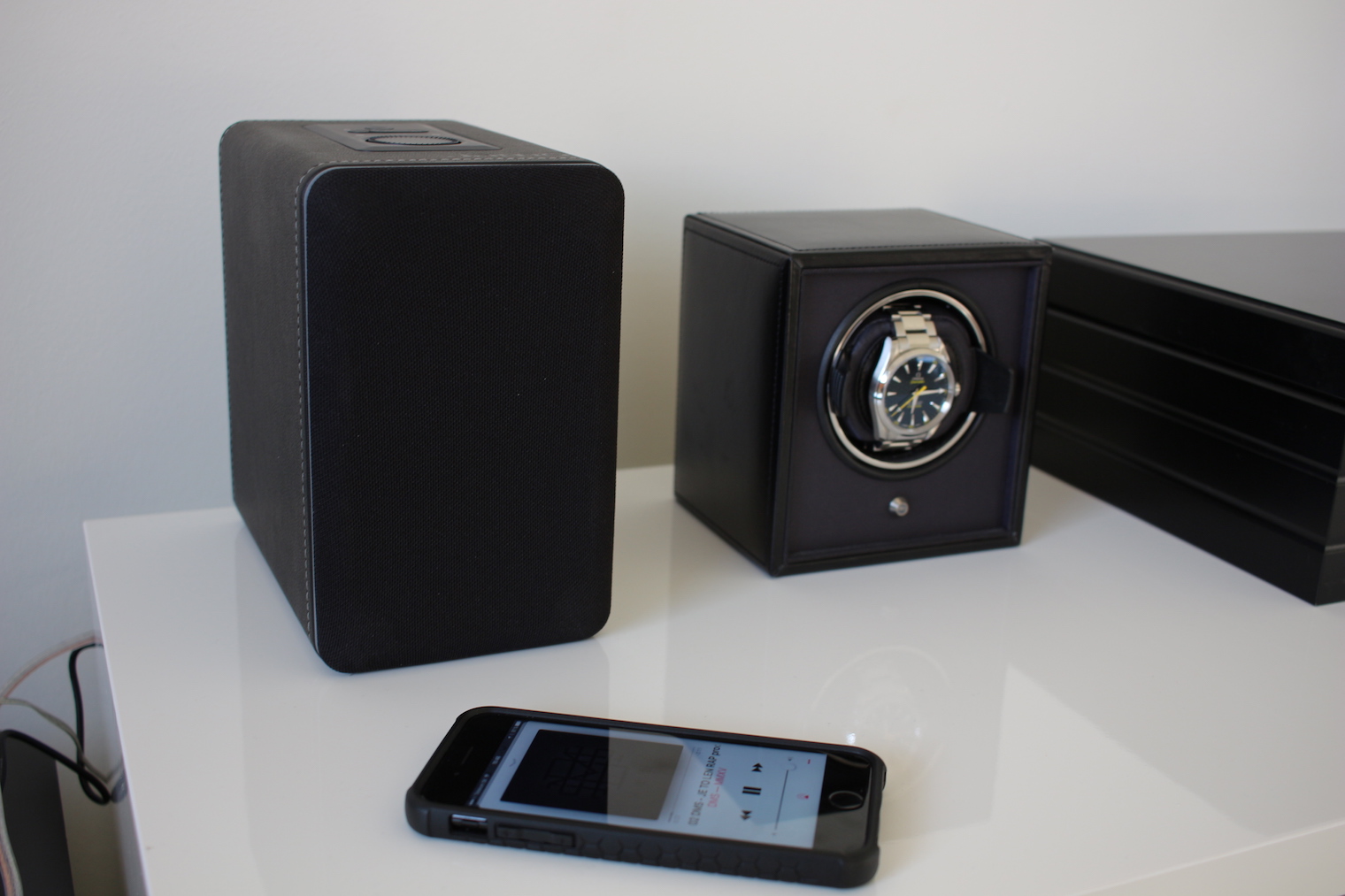 speaker watch phone on table