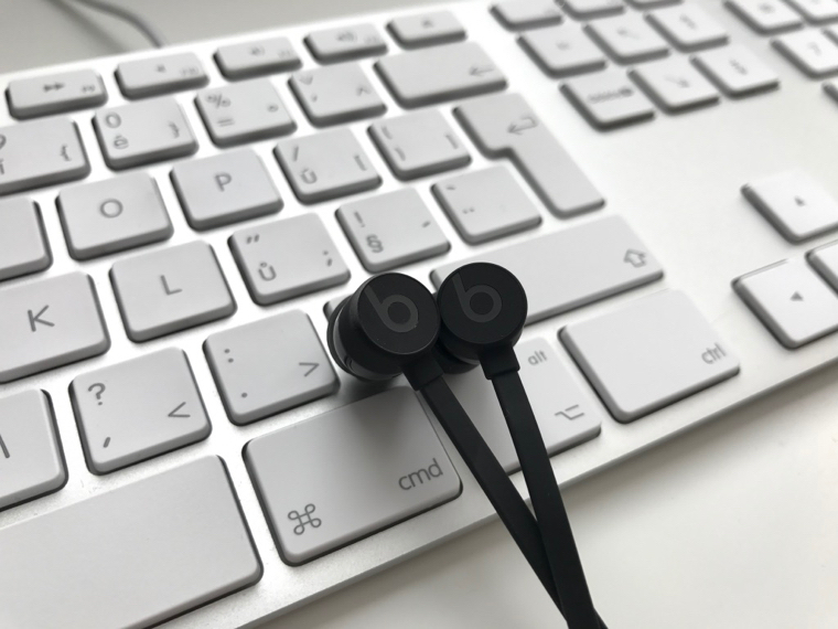 beats earbuds on keyboard