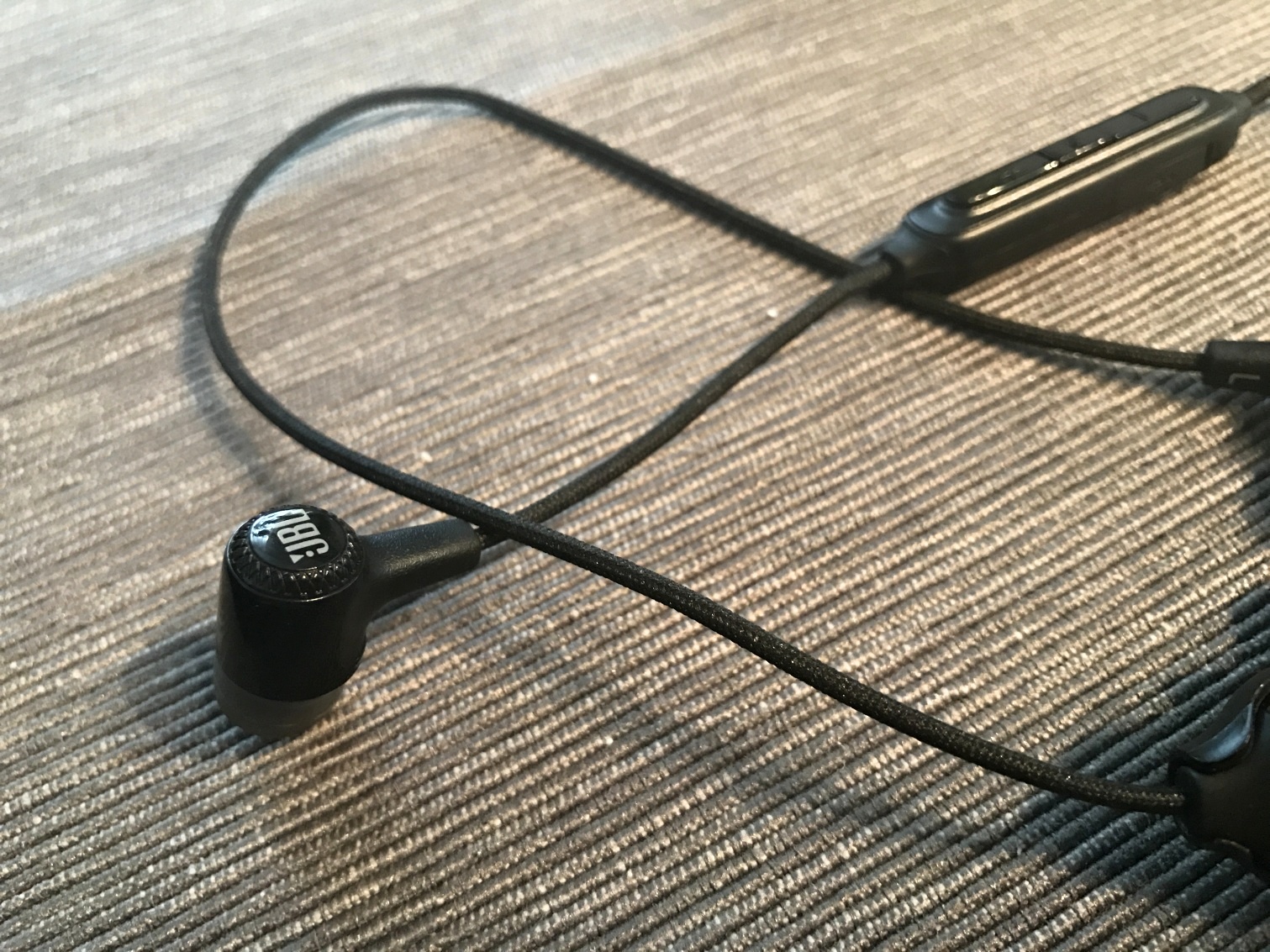 jbl earbud on table