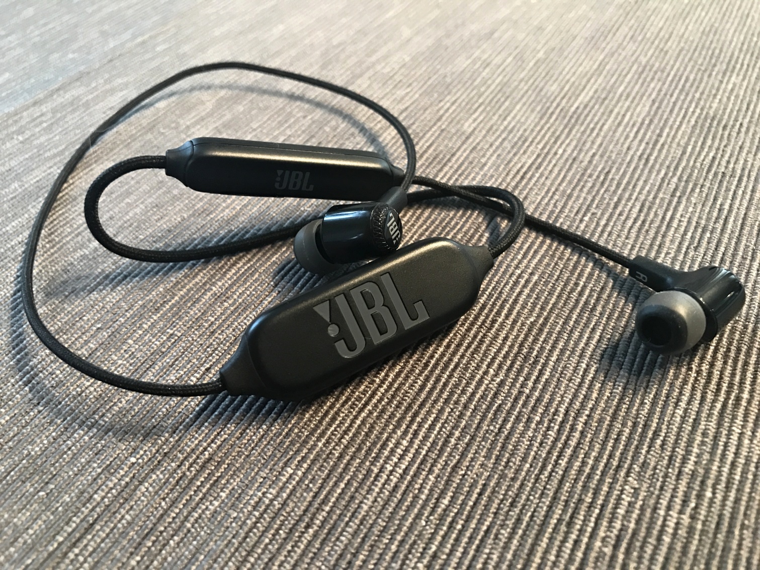 jbl earphones on fabric