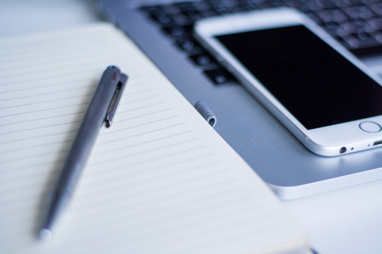 notebook and smartphone on laptop