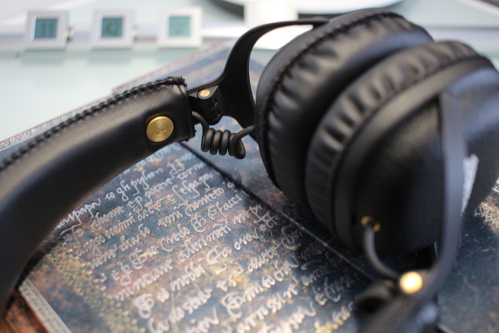 black headphones on book close
