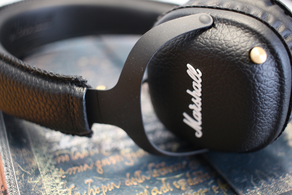 black headphones on book detail view