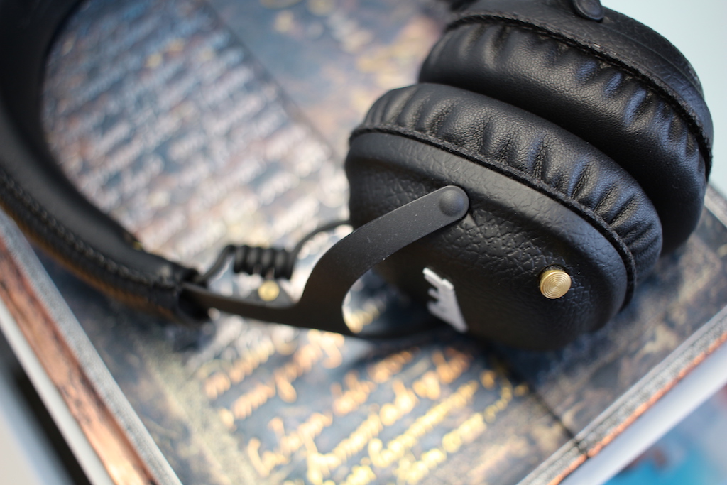 black headphones on book side angle