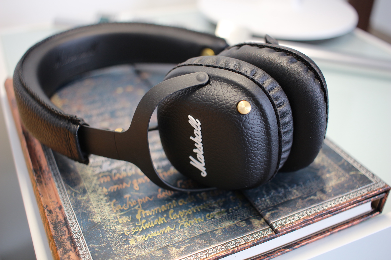 black headphones on book side view