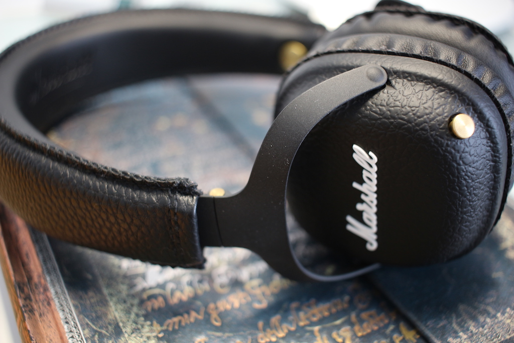 black headphones on book side