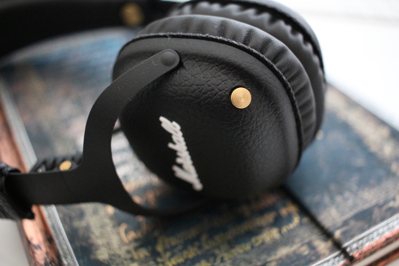 black headphones on book