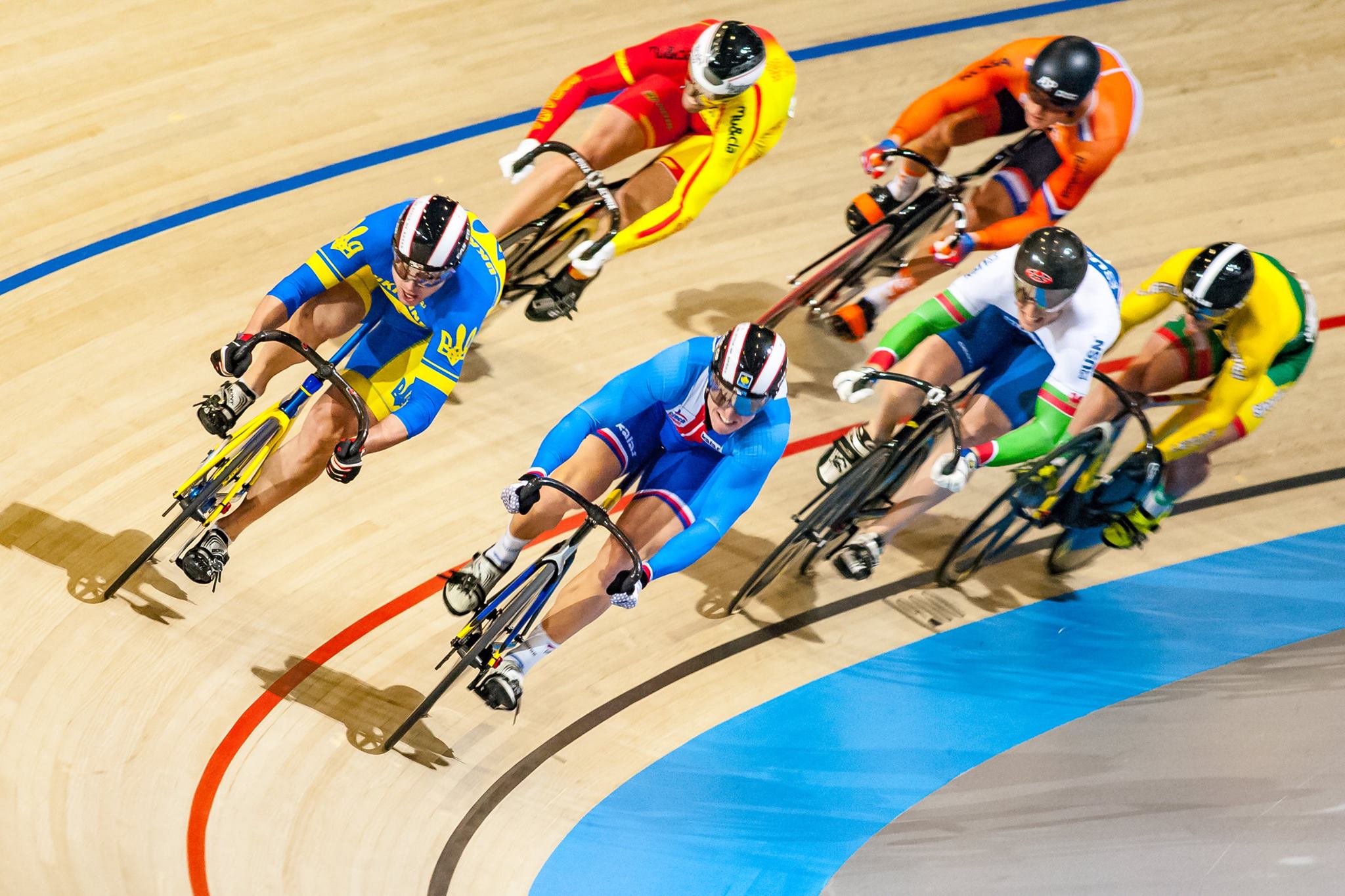 cyclists racing velodrome
