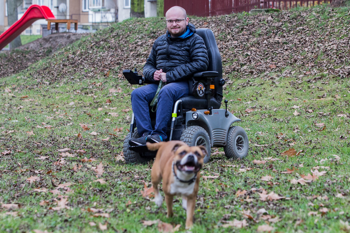 man in wheelchair with dog