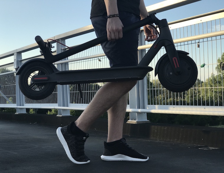 carrying folded electric scooter