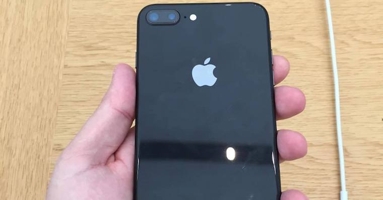 hand holding black iphone