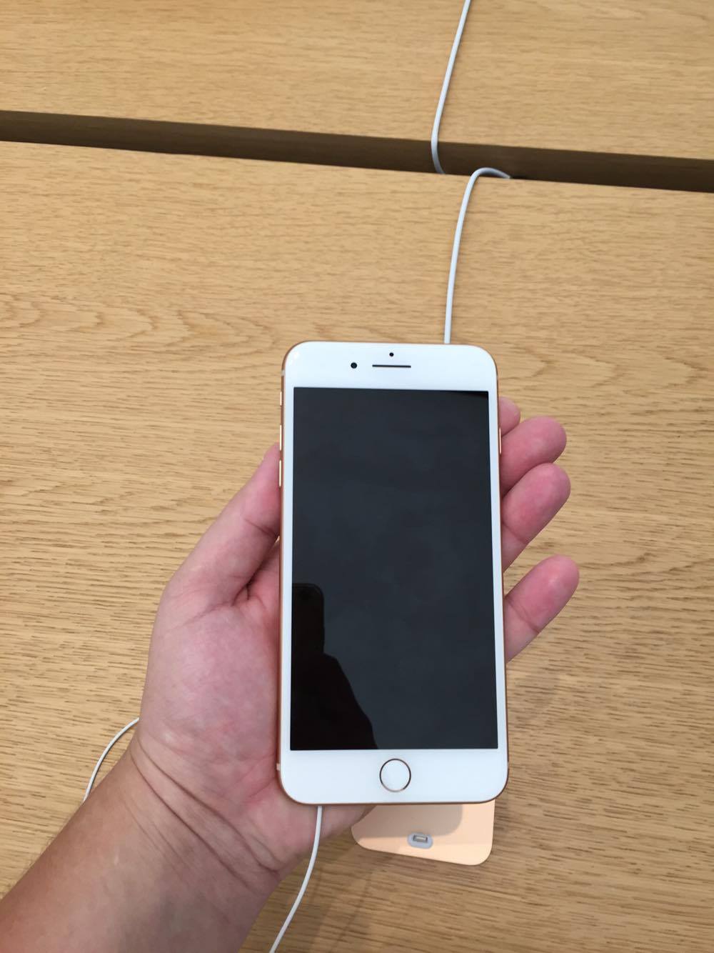 hand holding iphone 8 plus front