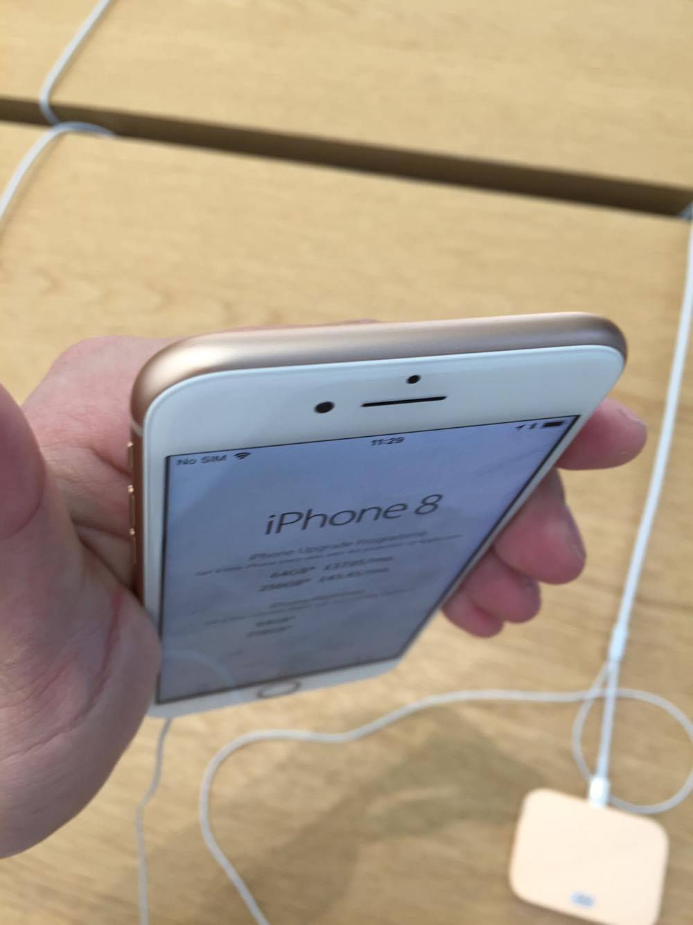 hand holding iphone top view