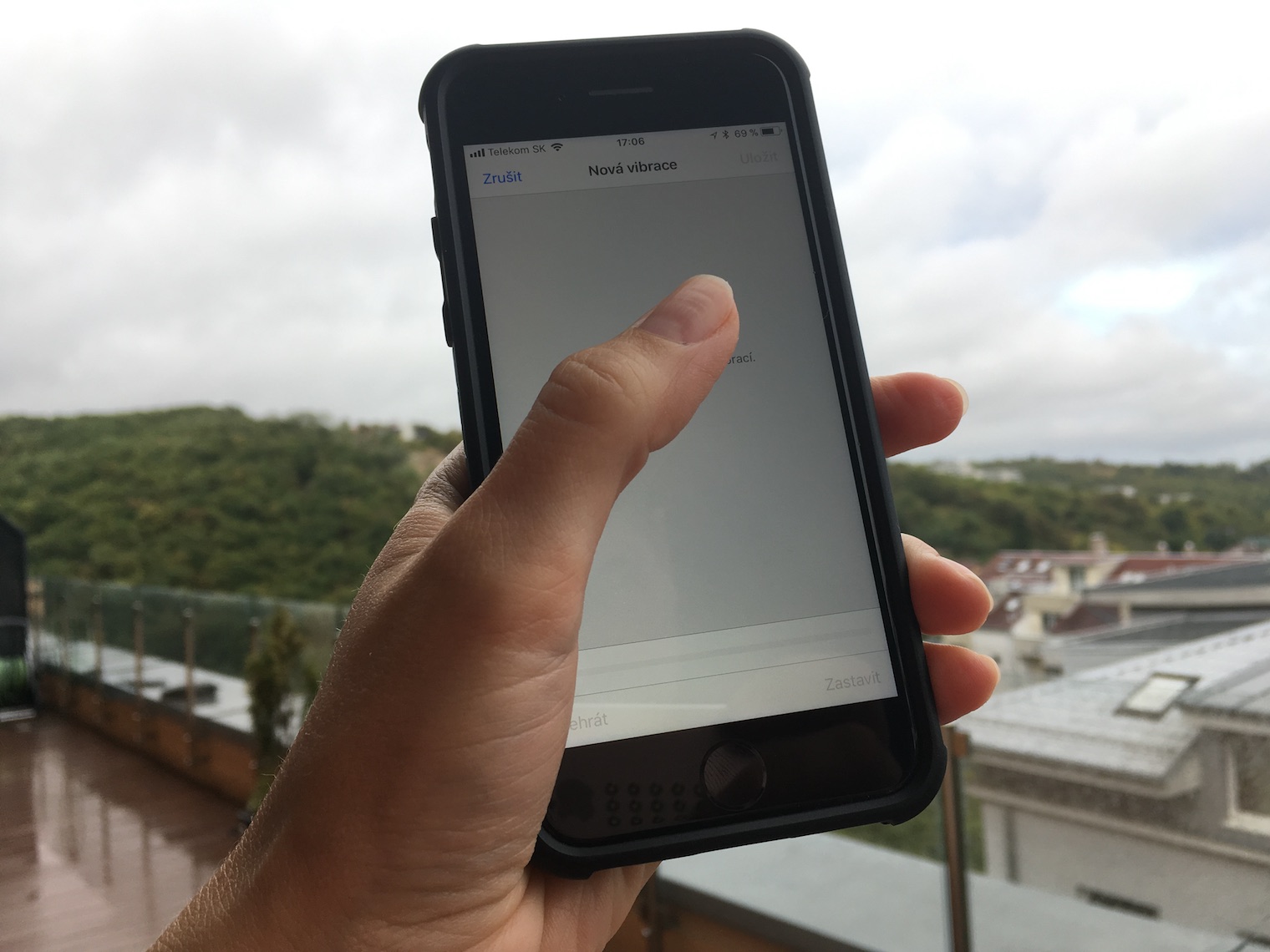 hand holding smartphone outdoor