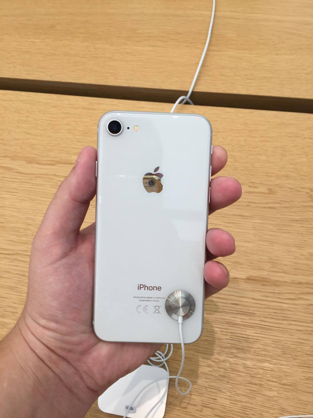 hand holding white iphone