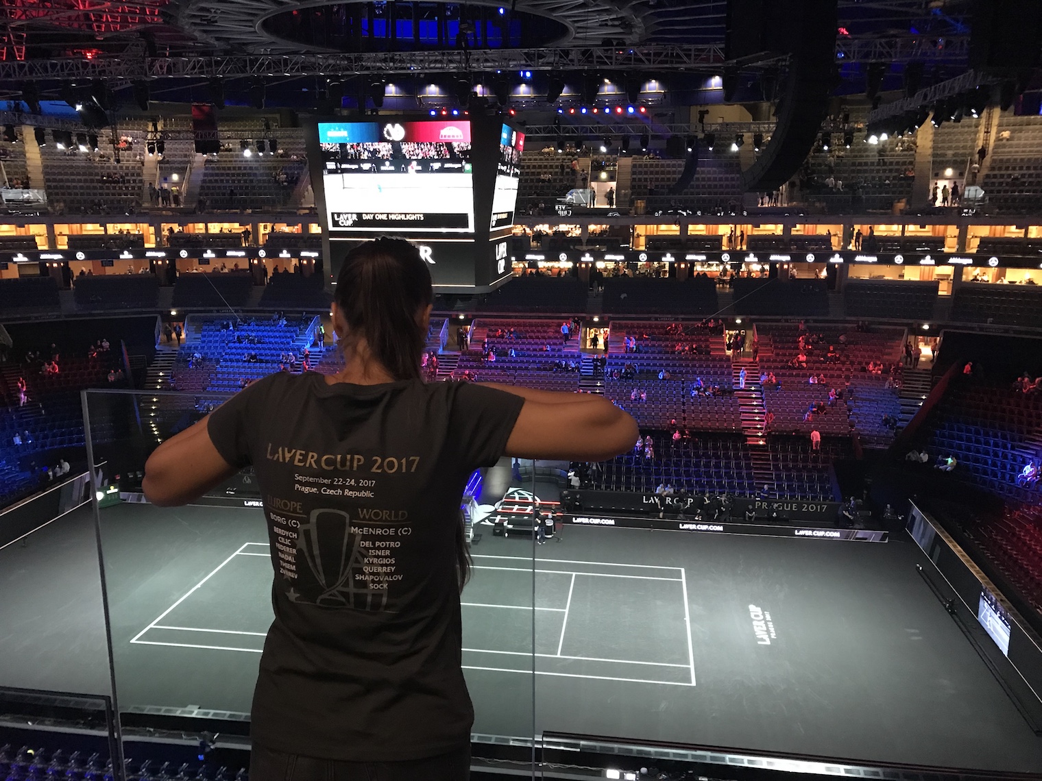 person overlooking tennis court