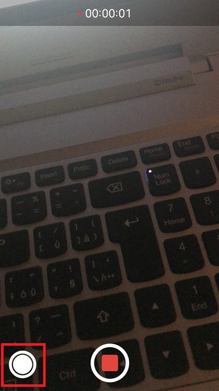 video recording on laptop keyboard closeup