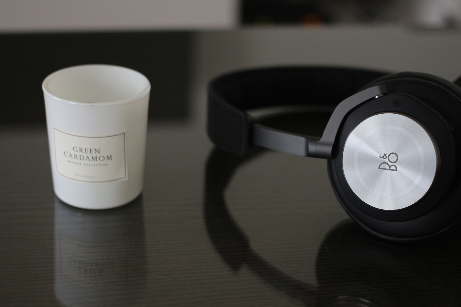 beoplay h9 headphones with candle