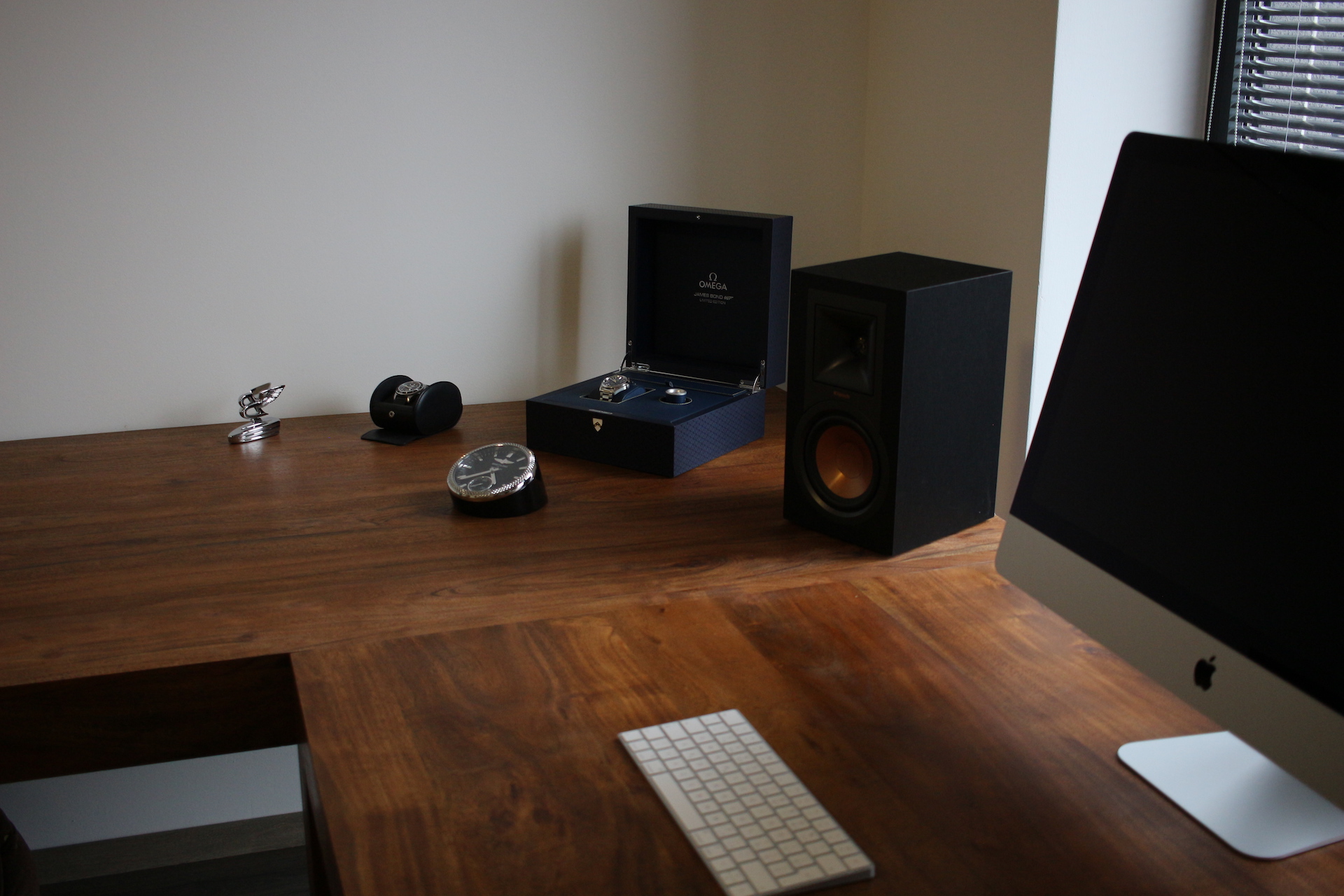 desk with speaker and watch box