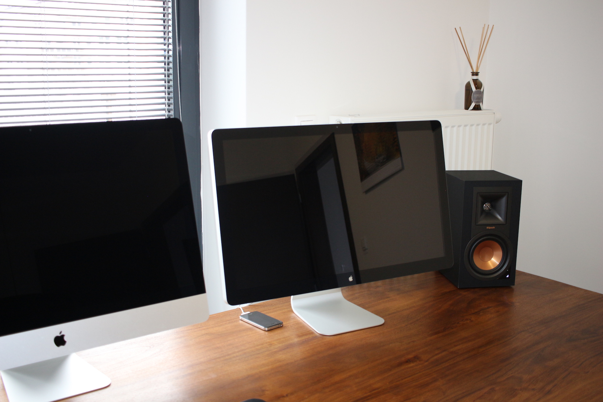 dual monitors on wooden desk