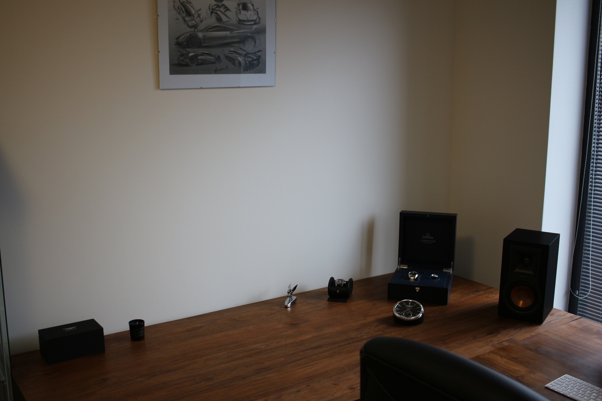 empty desk with speaker and clock