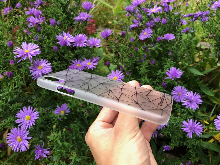 hand holding geometric phone case flowers side