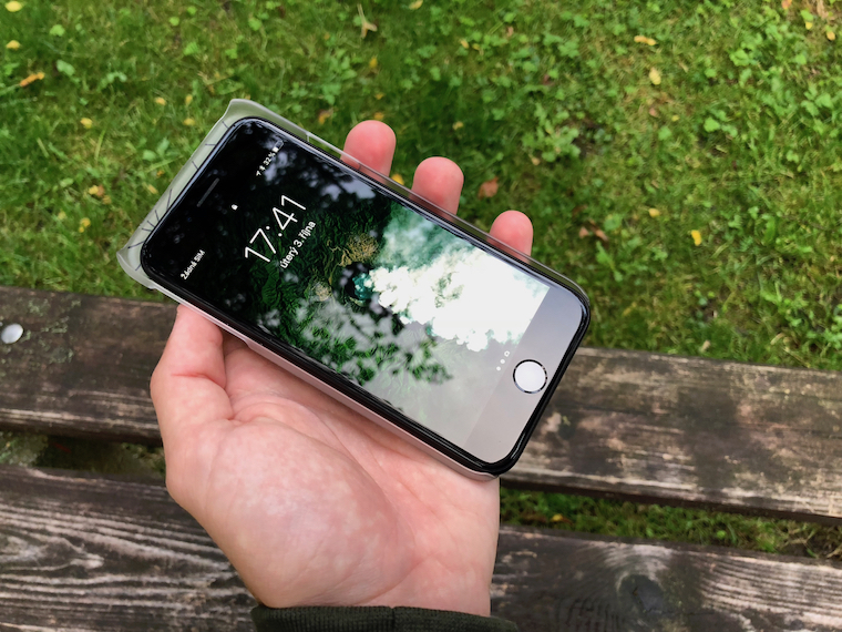 hand holding smartphone on bench vertical