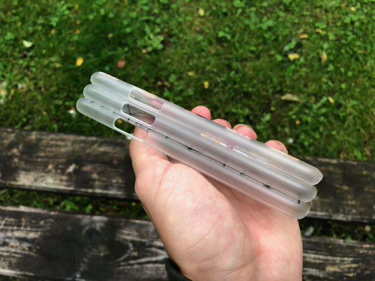 stacked clear phone cases hand