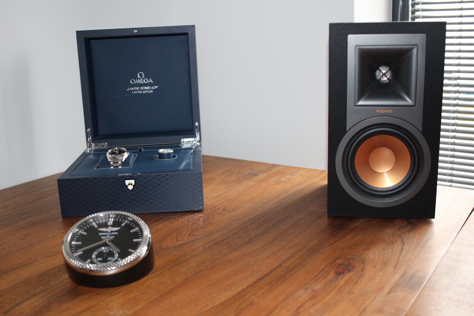 watch box and speaker on desk