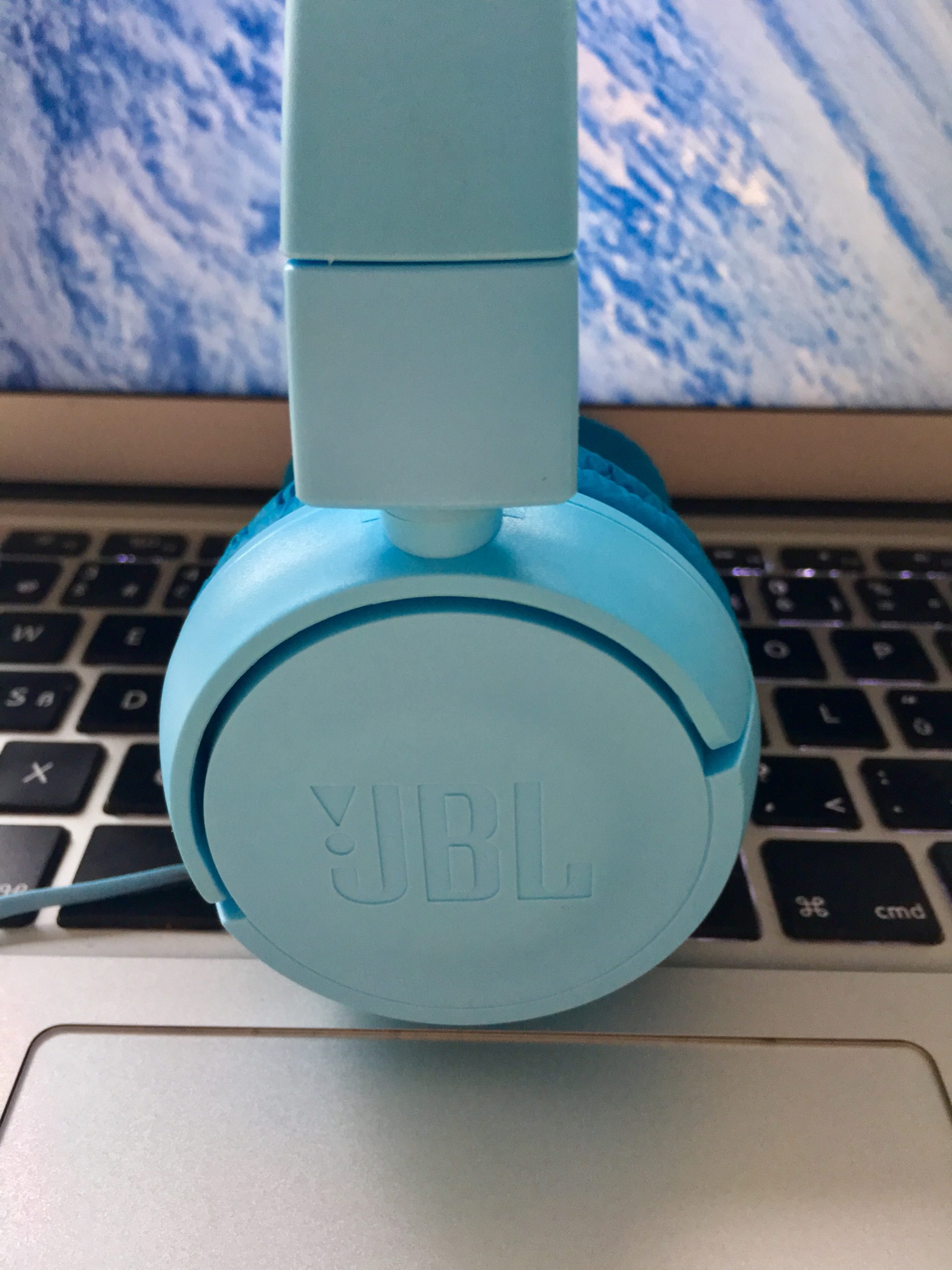 blue headphones on laptop