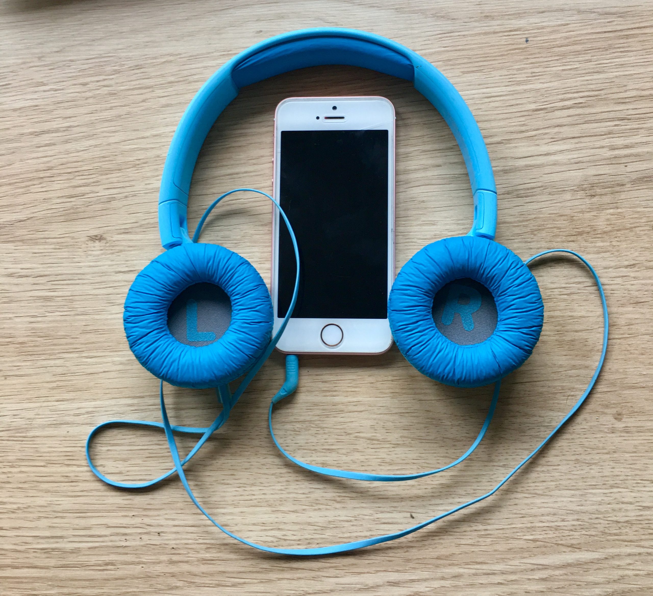 blue headphones with smartphone
