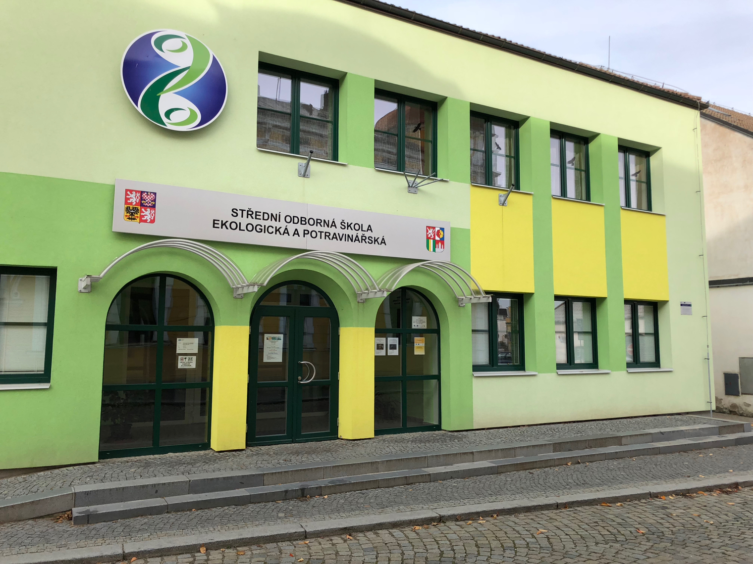 green and yellow school building