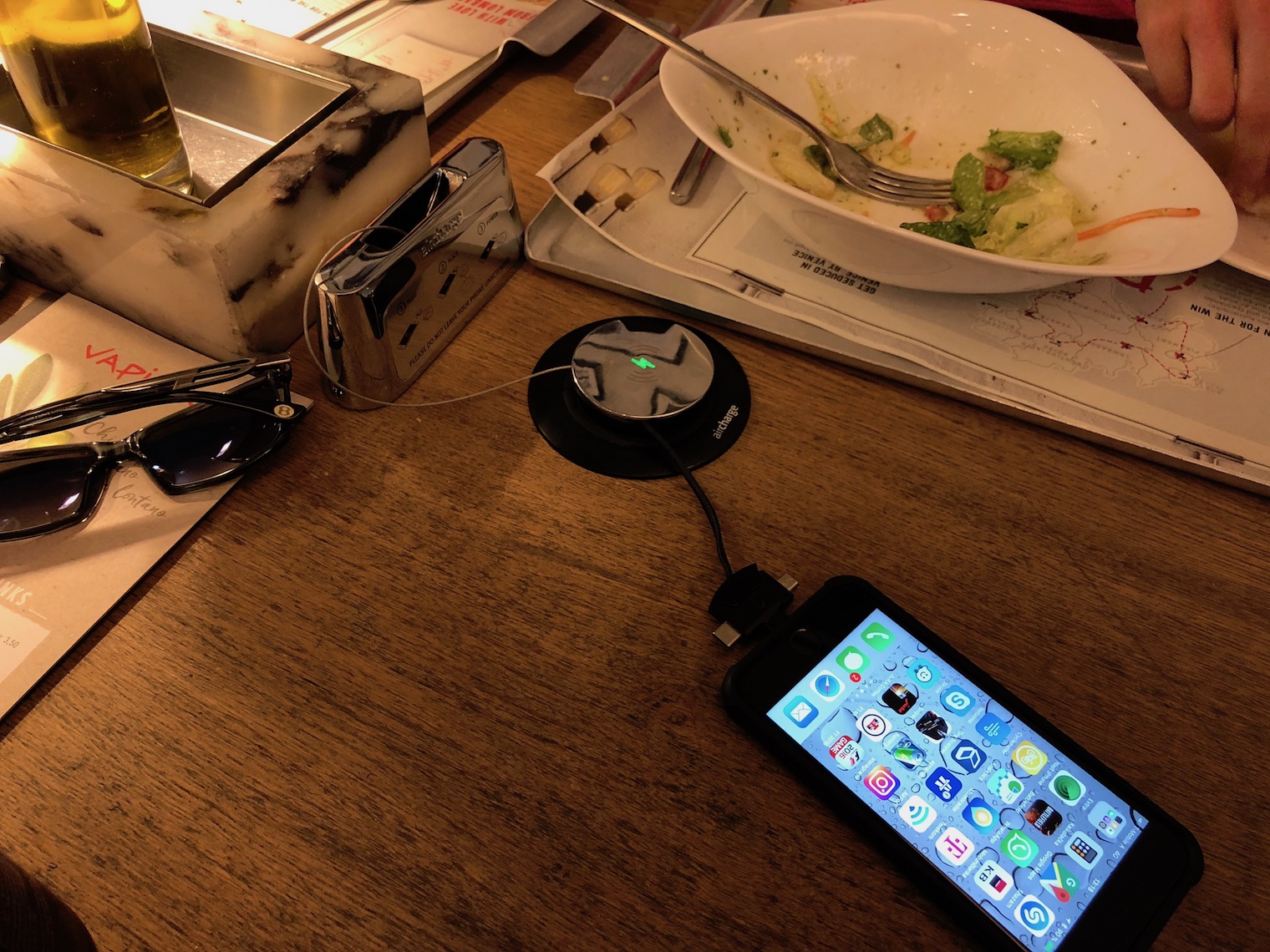 phone on table with salad