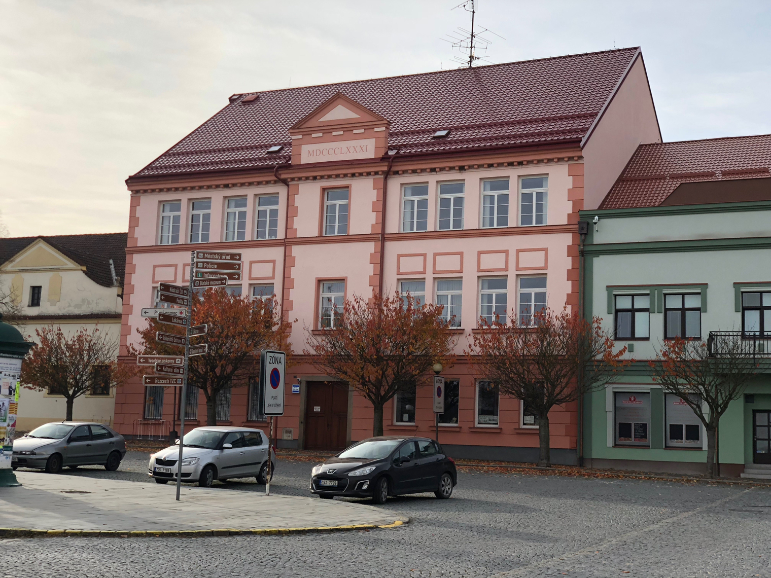 pink building with cars