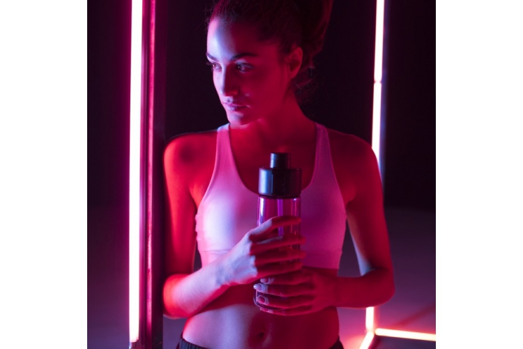 athlete holding water bottle