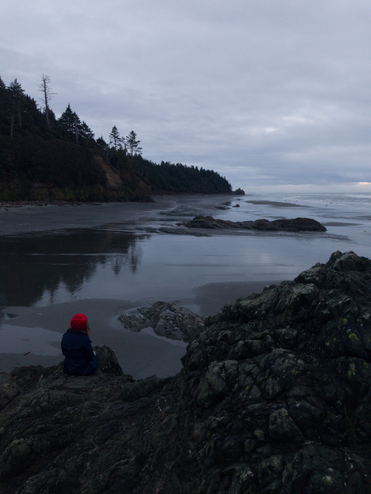 child on rocky beach