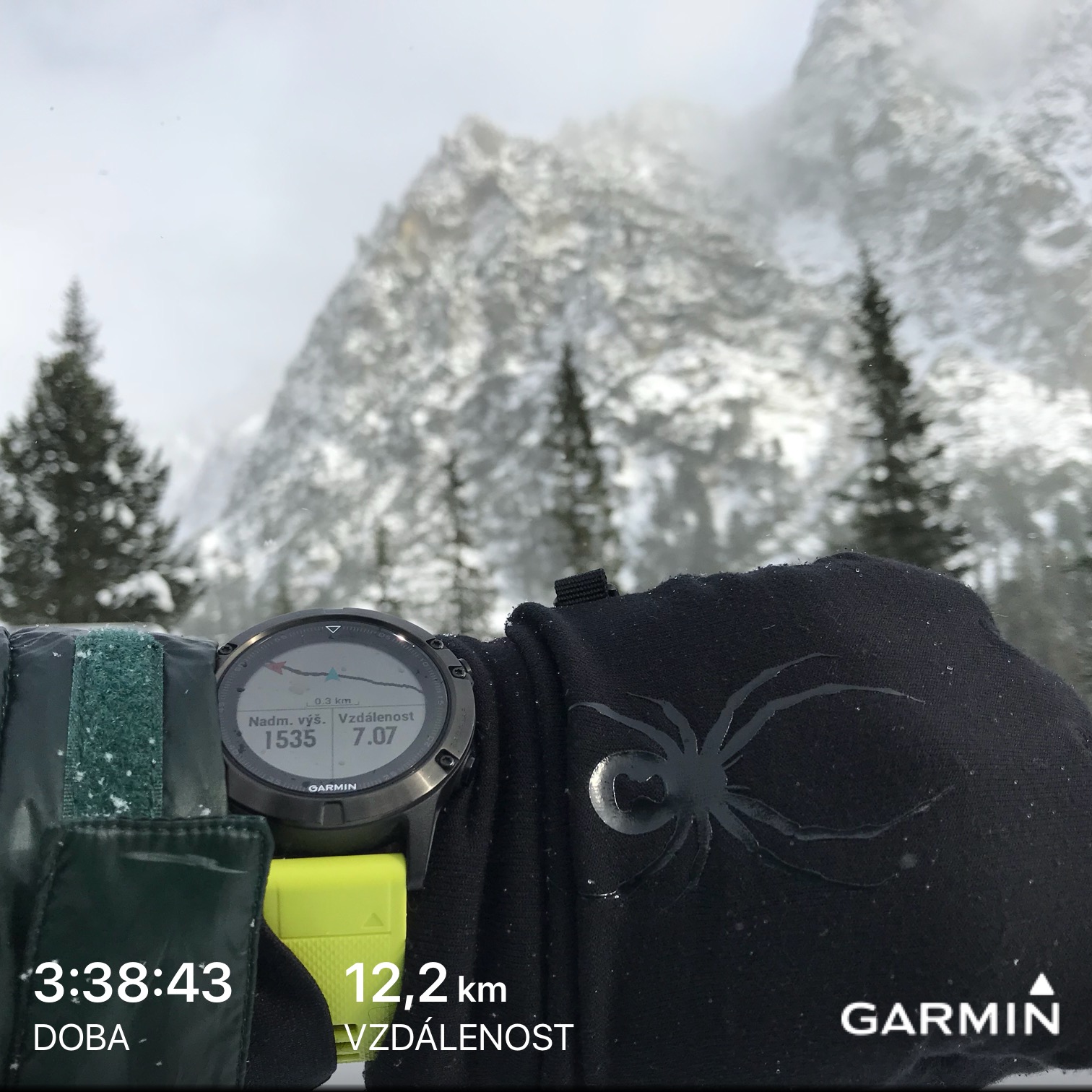 garmin watch in snowy mountains