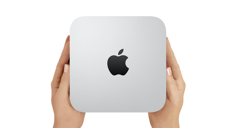 holding apple mac mini