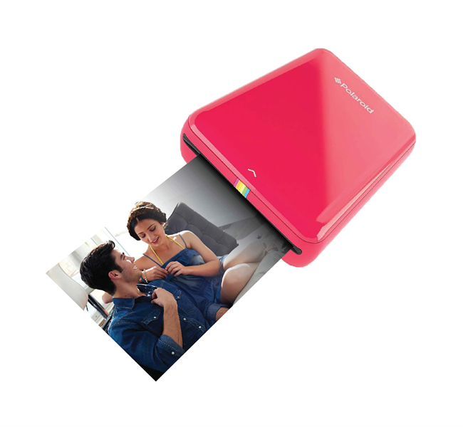 red polaroid printer printing photo