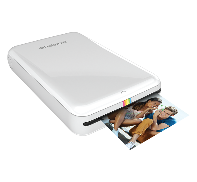 white polaroid printer printing photo