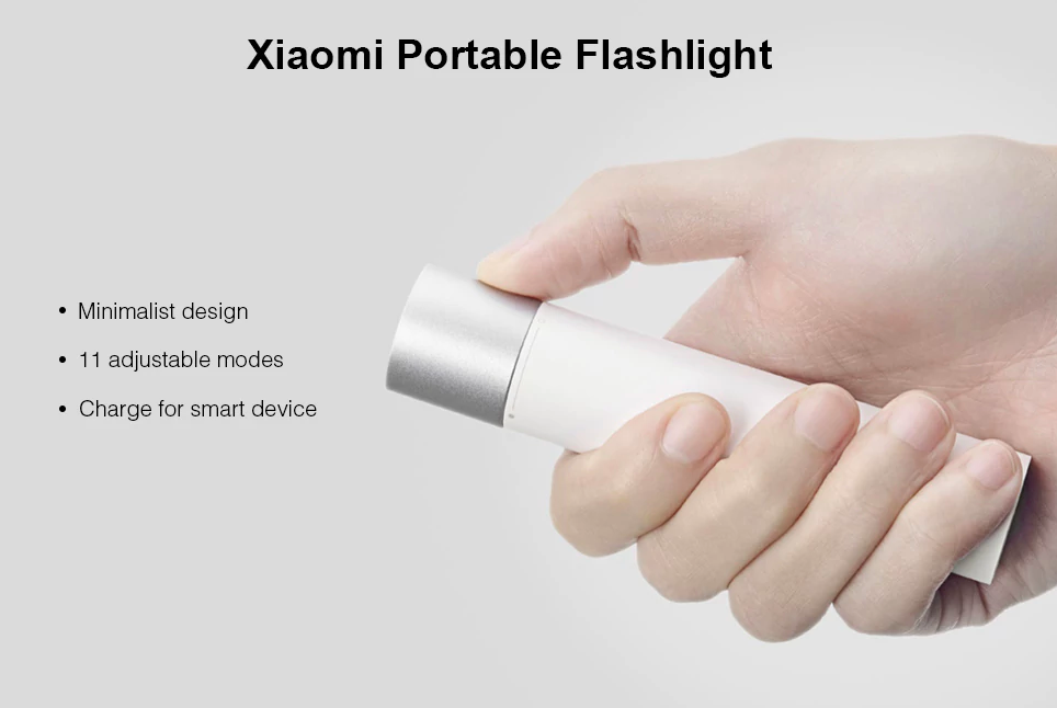 hand holding portable flashlight