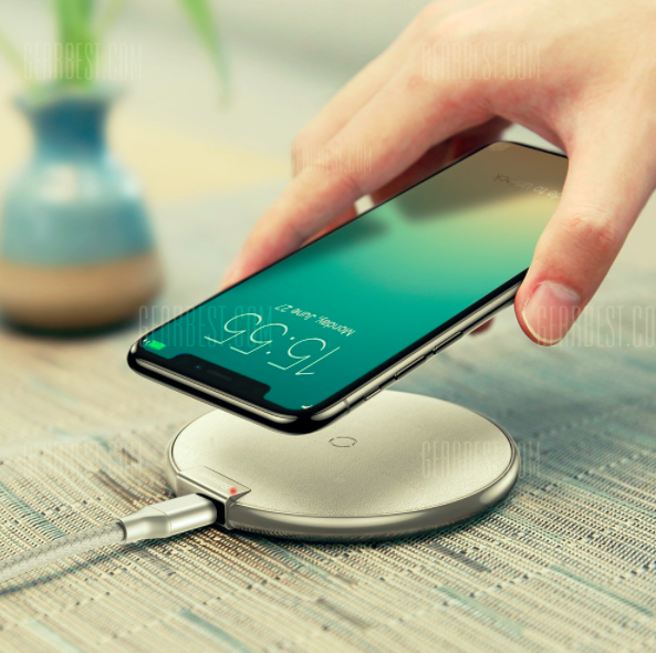 hand placing iphone on charger