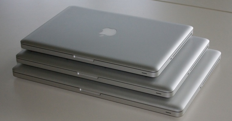 stacked closed macbooks