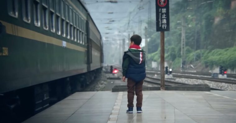 child watching train
